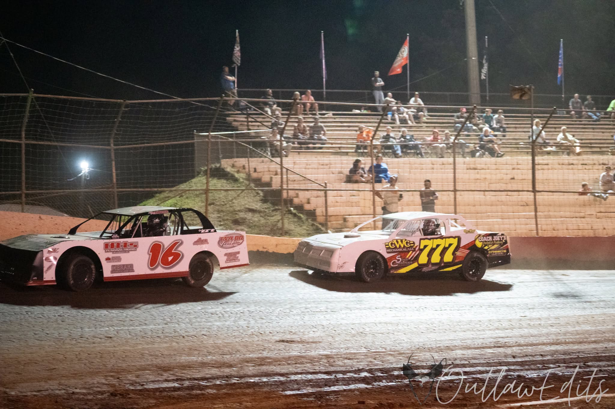 Factory stock cars racing under the lights